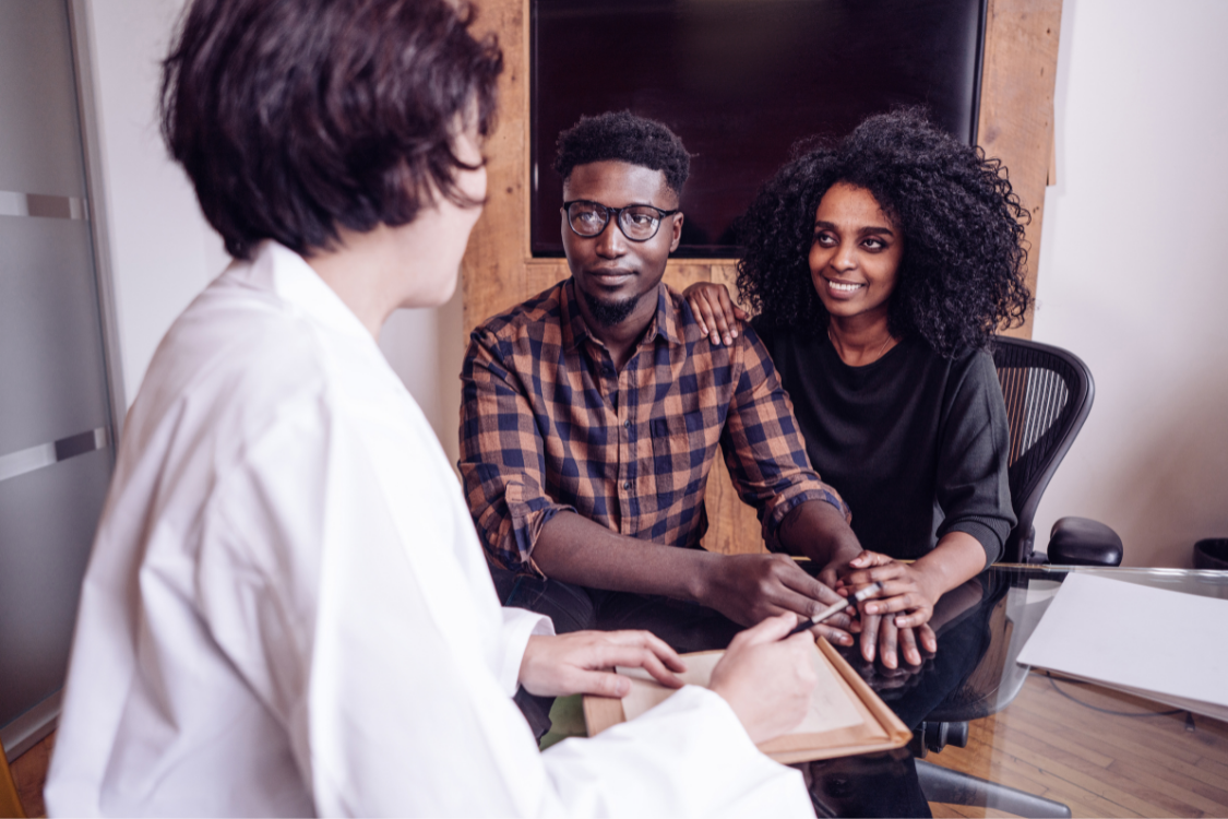 Couple Sitting with Doctor